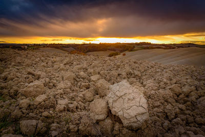 View of desert against cloudy sky