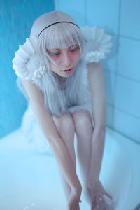 Low angle view of young woman in bathroom