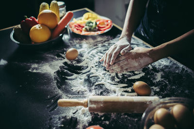 Cropped image of person preparing food