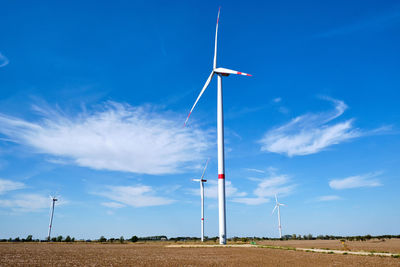 Wind energy generaton in a barren field seen in germany