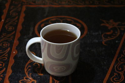 Close-up of coffee cup on table