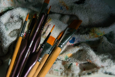 High angle view of paintbrushes in container