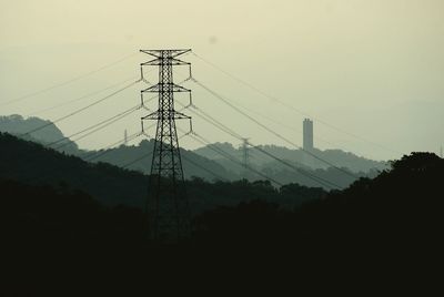 Electricity pylon against sky