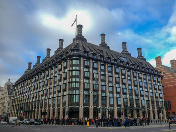 Group of people in front of buildings in city