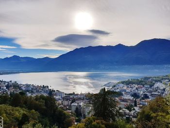 High angle view of townscape and mountains against sky