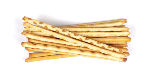 High angle view of stack on plate against white background