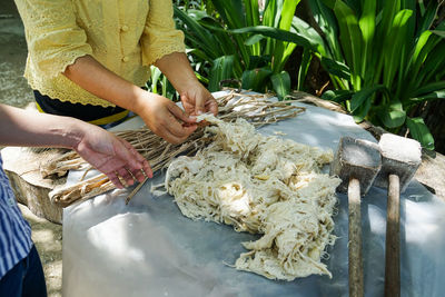 Midsection of woman holding fish