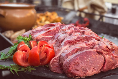 Fresh meat with tomato and herbs ready to put on the grill