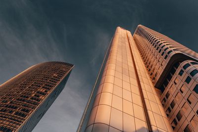 Low angle view of modern buildings against sky