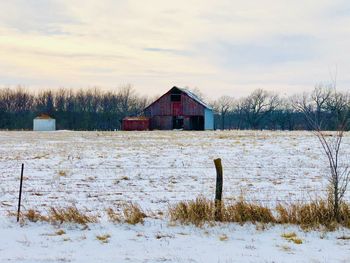 Old red barn with new fallen snow