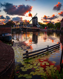 Scenic view of river against sky during sunset