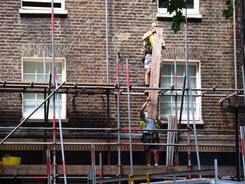 Rear view of man working