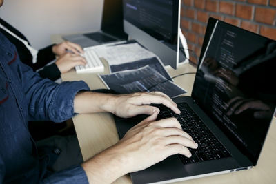 Man using laptop on table