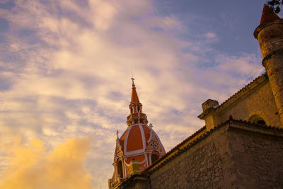 Low angle view of building against sky during sunset