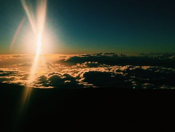 Scenic view of vapor trails in sky during sunset