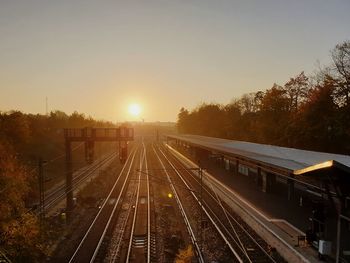 High angle view of railroad tracks against sky during sunset