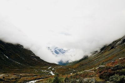 Scenic view of mountains against sky during winter