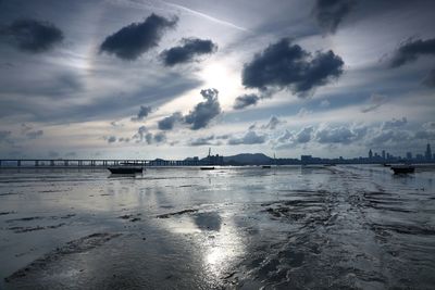 Scenic view of sea against cloudy sky