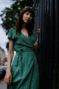 Portrait of a beautiful young woman standing outdoors