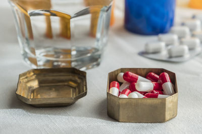 Close-up of wine glasses on table