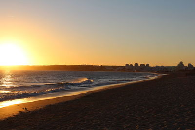 View of beach at sunset