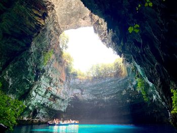 Scenic view of sea seen through cave