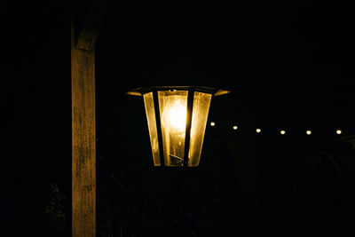 Low angle view of illuminated light bulb