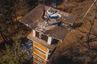 High angle view of people on street by trees