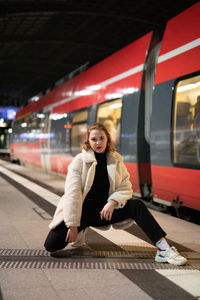 Portrait of woman at railroad station