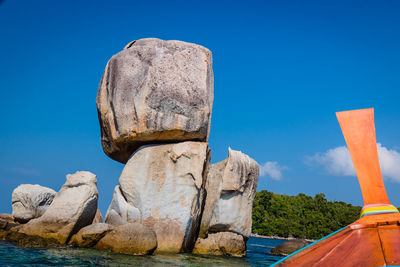 View of rock formation against blue sky