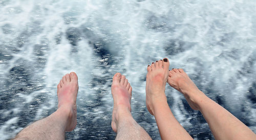 Low section of people in sea