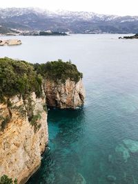 High angle view of rocks on sea shore