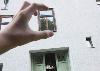 Man photographing through window