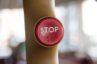 Close-up of stop button in a bus