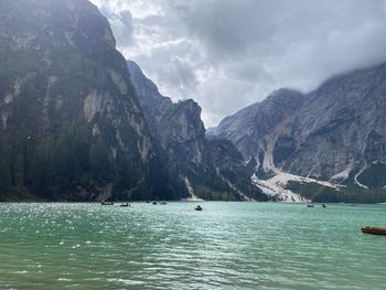 Scenic view of sea and mountains against sky