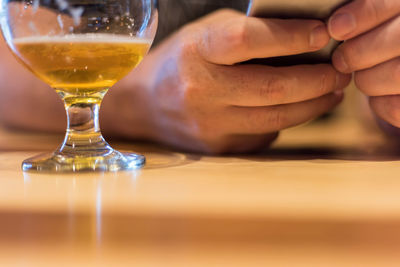 Close-up of beer glass on table