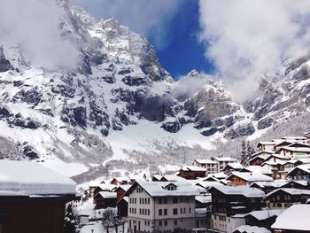 Scenic view of snow covered mountains against sky