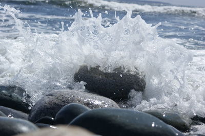 Close-up of water splashing on rocks