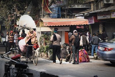 People at market stall in city