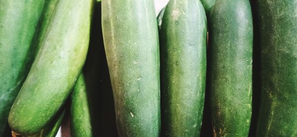 Full frame shot of green chili peppers at market