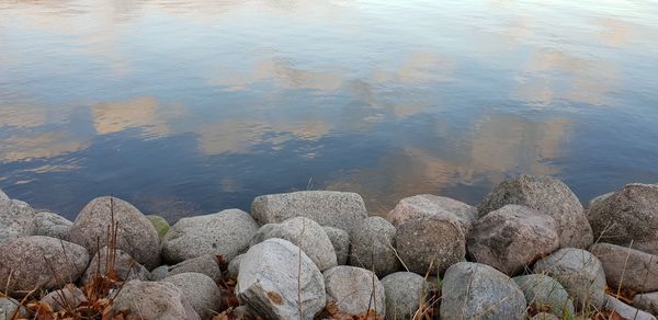 High angle view of stones at lakeshore