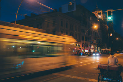 Blurred motion of bus on street in city