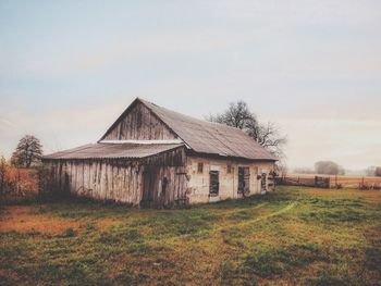 House on field against sky