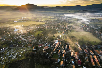 Bixad, transylvania. colored sunset aerial view of bixad, romania.