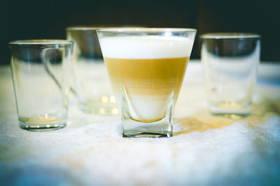 Close-up of beer glass on table