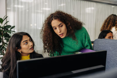 Focused female entrepreneurs working together at office