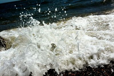 Waves splashing on rocks