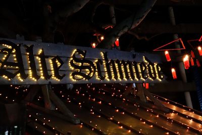 High angle view of illuminated candles in building