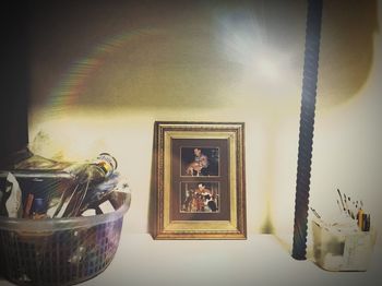 Close-up of illuminated statue at home