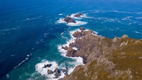 High angle view of rock formation in sea